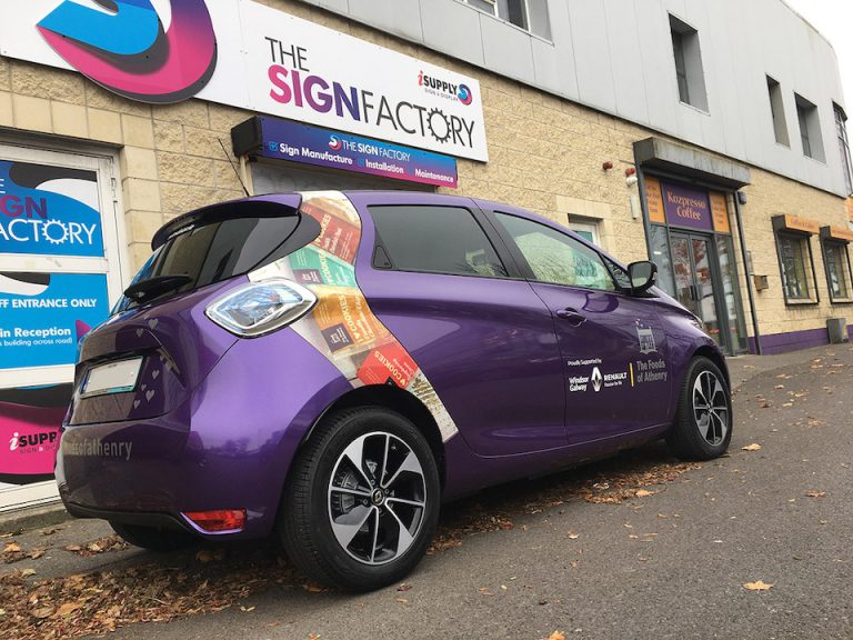 An example of a branded car with a custom vinyl design - vehicle wrap